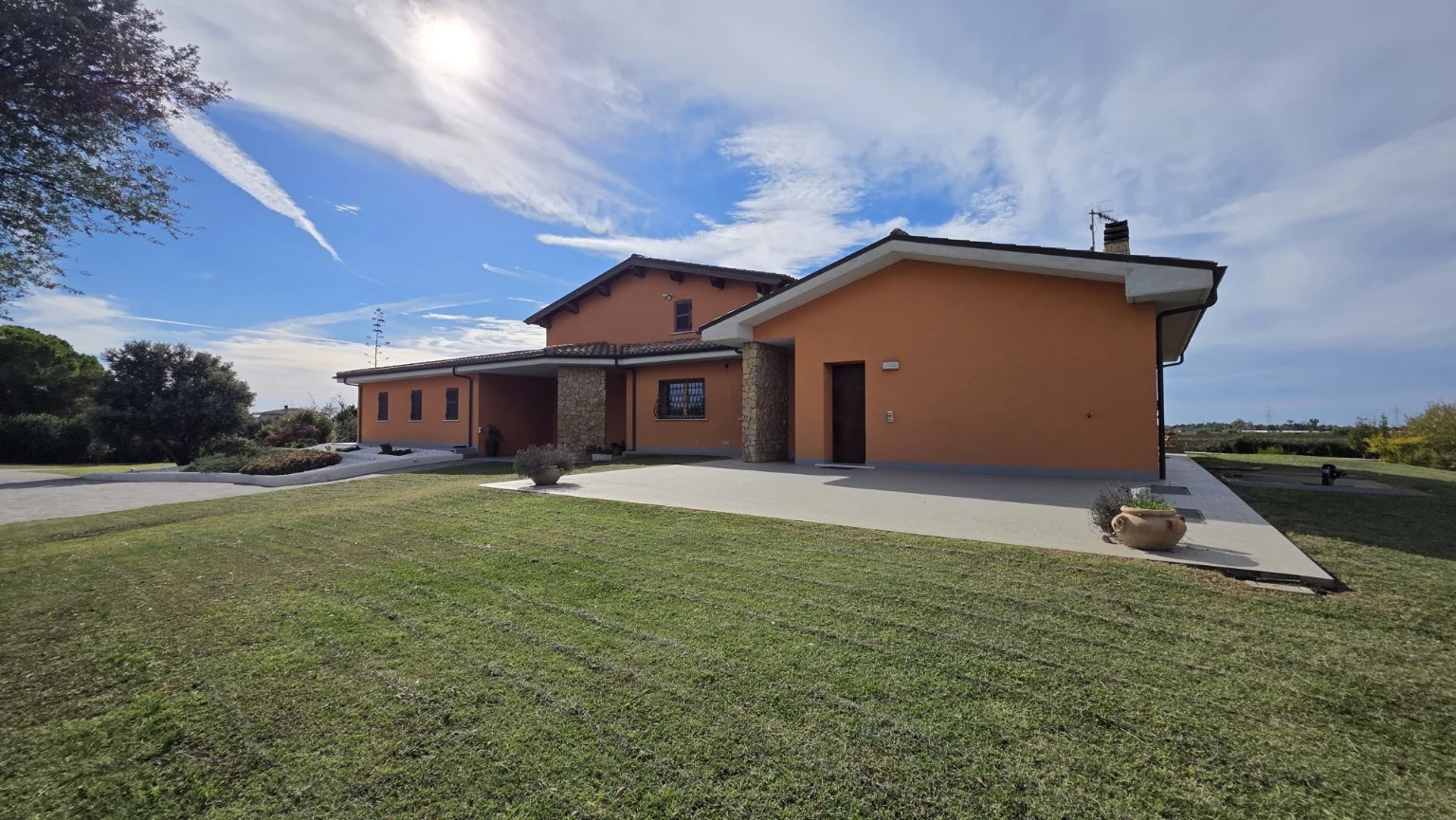 The detached villa and its outdoor spaces