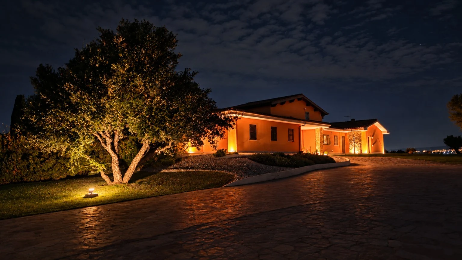 The villa and garden as evening falls