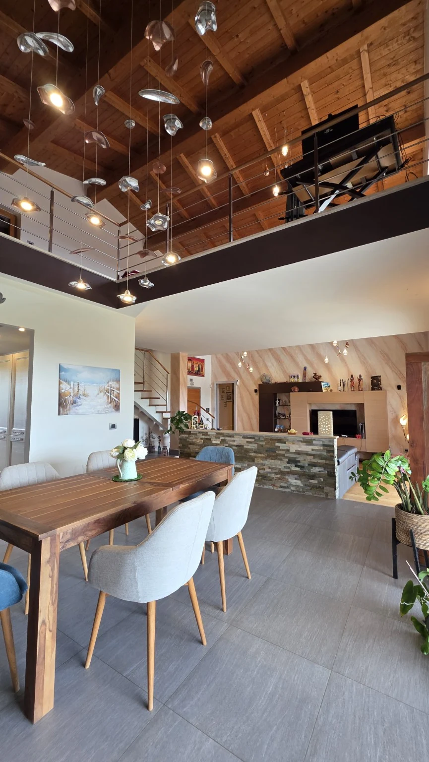 Dining area, double-height ceiling and mezzanine